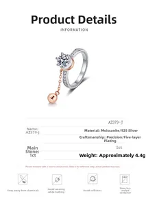 Macro detail of 925 silver moissanite ring with rotatable rose gold bead and 1ct center stone