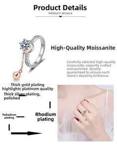 Detailed view of six-prong moissanite ring featuring a dangling bead and multilayer plating