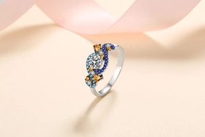 Macro view of S925 silver Angel Eye ring with colorful gemstones and center moissanite