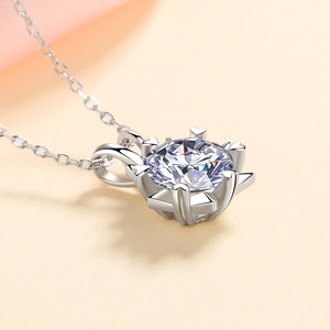 Elegant S925 sterling silver necklace featuring heart-shaped prongs and round moissanite