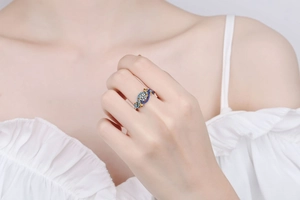 Detail of S925 sterling silver ring with angel eye design and colorful pavé stones