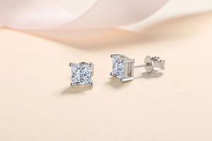 Close-up of S925 sterling silver earrings showing the princess cut square moissanite stone
