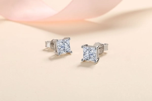 Macro shot of S925 sterling silver square moissanite earrings with four-prong setting