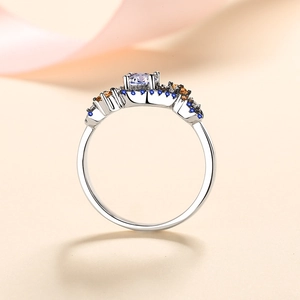 S925 sterling silver ring featuring a round white zircon with blue and amber side stones