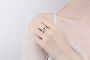 Detail of S925 silver ring featuring round moissanite and floral vintage engraving