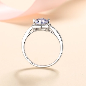 Elegant S925 sterling silver ring featuring a round lavender moissanite and halo setting