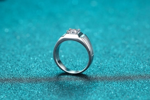 Macro shot of 925 silver ring featuring a round moissanite and brushed metal finish
