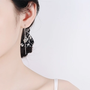 S925 silver tassel drop earrings with geometric cube pendants and zircon stones on model