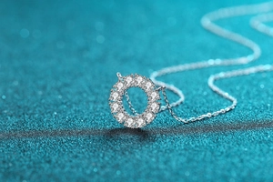 Macro shot of S925 silver round pendant necklace with 12 sparkling moissanite stones