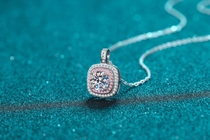 Macro shot of 925 silver square necklace pendant with pink moissanite double halo stones