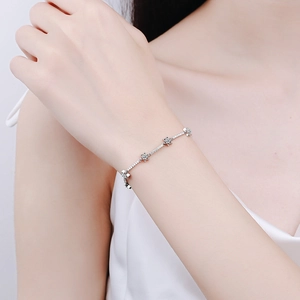 Elegant 925 sterling silver star bracelet with shimmering moissanite stones on wrist