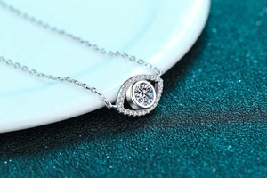 Macro shot of silver S925 Angel Eye pendant with brilliant moissanite and micro-pave stones