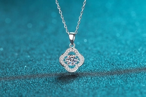 Macro detail of S925 silver clover pendant necklace with brilliant cut moissanite