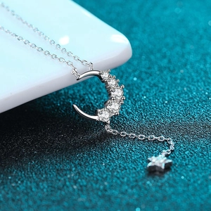 S925 silver crescent moon and star necklace with shimmering white round cut gemstones