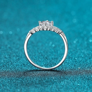 Classic crown princess S925 sterling silver ring with moissanite center stone on blue glitter
