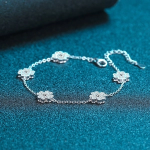 Elegant 925 sterling silver five-flower bracelet featuring micro-pave moissanite accents