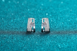 Detail of S925 sterling silver rectangular earrings with moissanite and claw setting