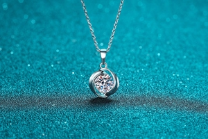 Macro shot of a brilliant round cut moissanite pendant on a S925 sterling silver chain