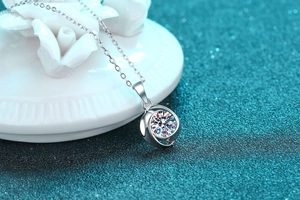 Macro shot of S925 sterling silver swirl pendant with brilliant moissanite stone