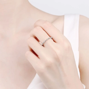Elegant 925 sterling silver eternity ring with sparkling moissanite stones on model