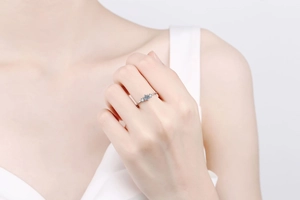 Detailed close-up of S925 sterling silver ring with three sparkling moissanite stones