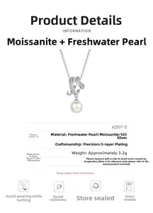 Detail of cross-shaped 925 silver pendant with moissanite and 8mm freshwater pearl