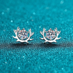 Elegant S925 sterling silver reindeer horn earrings with moissanite stones on blue background