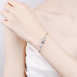 Elegant S925 sterling silver bangle with a sparkling blue moissanite centerpiece