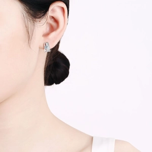Elegant S925 sterling silver rectangular earrings with moissanite stones on female model