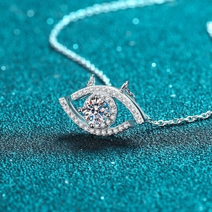 925 silver Evil Eye pendant necklace with brilliant moissanite on blue glitter background