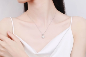 Detail of S925 sterling silver necklace with white pearl and sparkling pavé moissanite stones