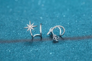 Close-up of 925 sterling silver star stud earrings with pave-set moissanite accents