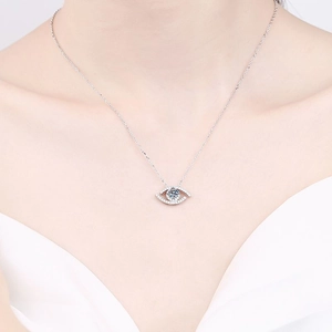 925 sterling silver evil eye necklace with moissanite pendant worn by model on white dress