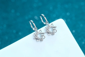 Detailed view of S925 sterling silver hexagram star earrings with inlaid moissanite stones
