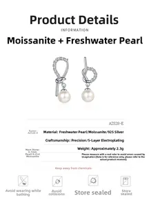 Macro detail of S925 silver asymmetric earrings with moissanite and 7mm pearls