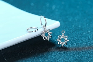 Close-up of S925 silver hoop earrings with detachable star and heart charms set with zircon