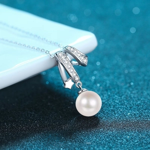 S925 sterling silver necklace featuring a crisscross ribbon design with a white pearl