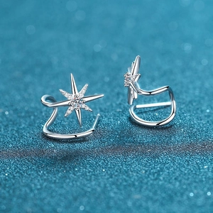 925 silver star ear cuff with sparkling moissanite stones on a blue background