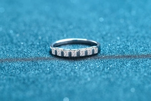Macro view of S925 sterling silver ring featuring seven princess cut square zircons