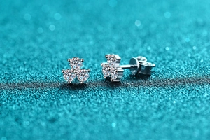 Macro shot of S925 sterling silver clover earrings with three moissanite stones and S925 stamp
