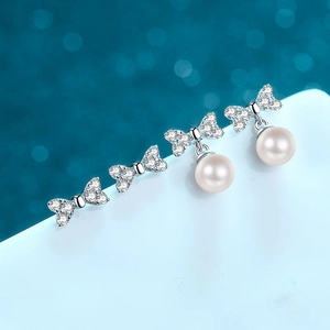 Elegant S925 silver bow stud earrings set with freshwater pearls and moissanite stones