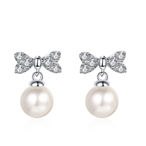 Elegant 925 sterling silver bow earrings with 6mm freshwater pearls and moissanite