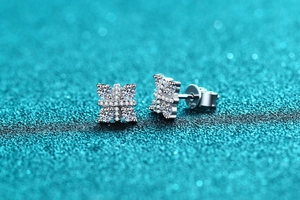 Macro shot of S925 sterling silver knot earrings with sparkling moissanite stones