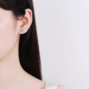 Minimalist 925 sterling silver clover stud earrings featuring sparkling moissanite petals