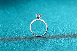 Macro detail of S925 sterling silver heart moissanite ring with four-prong setting