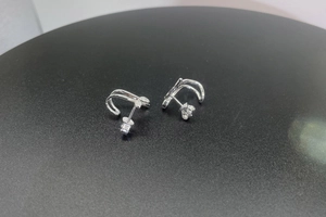 Detail of S925 sterling silver stud earrings with double arc geometric design