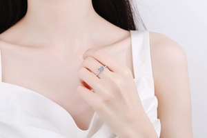 Macro shot of S925 sterling silver ring with heart-shaped light blue gemstone and accents