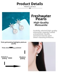 Macro detail of S925 silver snowflake earrings with 8mm freshwater pearls and moissanite