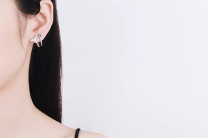 Detailed view of silver mermaid tail earring featuring sparkling micro-pave cubic zirconia