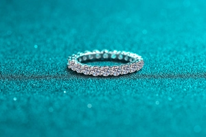 Macro shot of S925 sterling silver eternity ring with pave set Moissanite gemstones